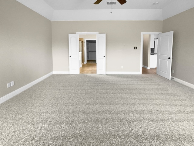 unfurnished bedroom with ceiling fan and light colored carpet