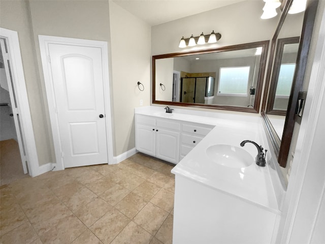 bathroom featuring walk in shower, vanity, and tile patterned floors