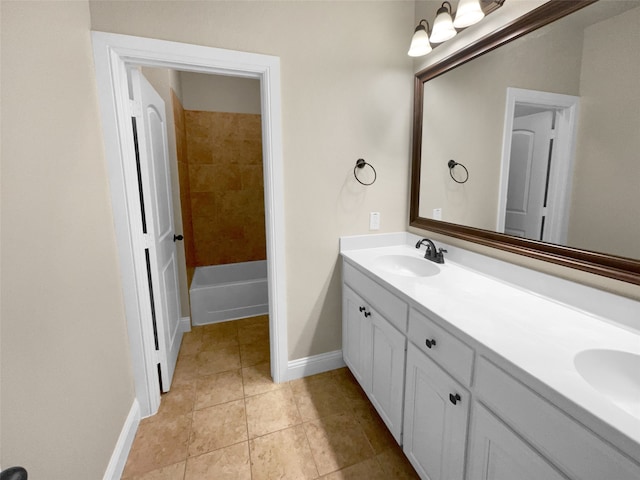 bathroom with vanity, a bathing tub, and tile patterned floors