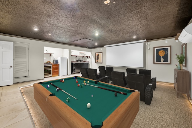 recreation room with light tile patterned flooring, a textured ceiling, wine cooler, and billiards