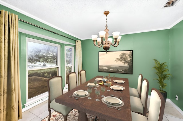 dining area with light tile patterned floors, ornamental molding, a textured ceiling, and an inviting chandelier