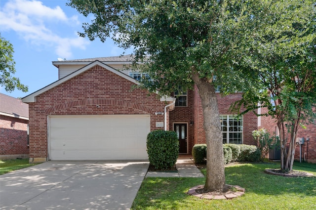 view of front property with a garage and a front yard