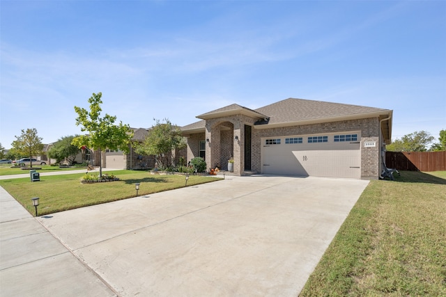 prairie-style house with a front lawn and a garage