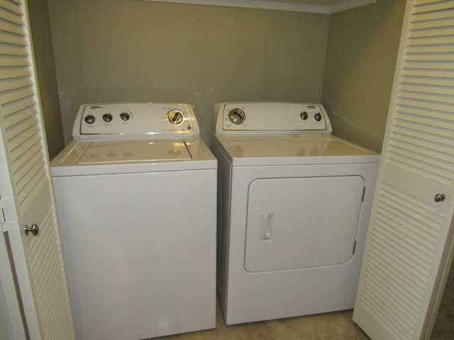 clothes washing area featuring washer and clothes dryer