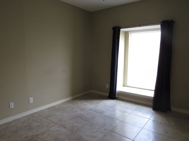 empty room with light tile patterned floors