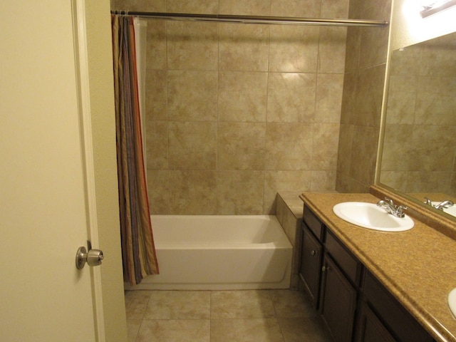 bathroom featuring tile patterned flooring, vanity, and shower / bath combination with curtain