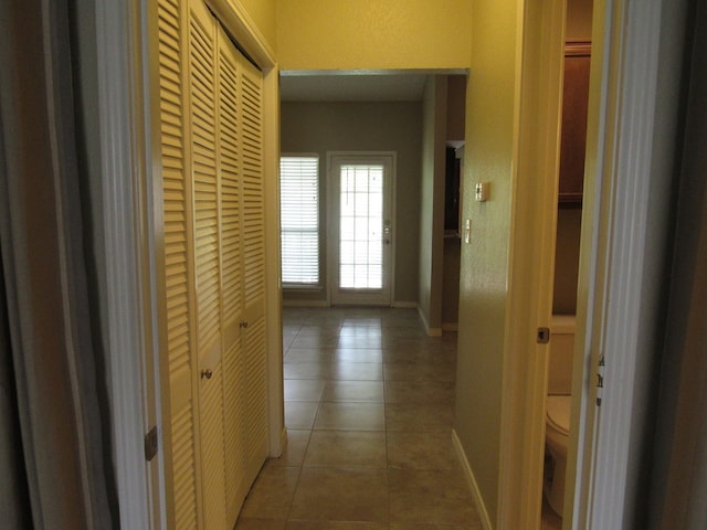 hall featuring tile patterned flooring