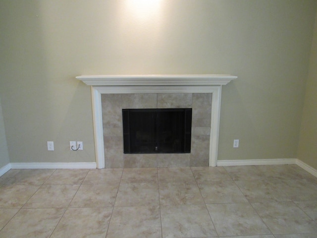 interior details featuring a fireplace and tile patterned floors