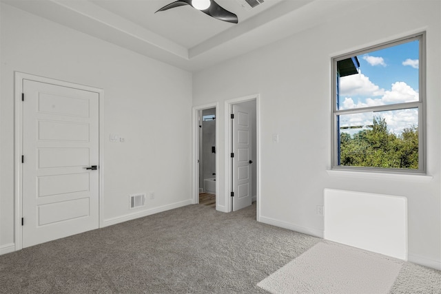 unfurnished bedroom with ceiling fan and carpet flooring