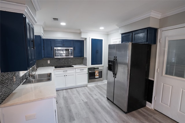 kitchen featuring blue cabinets, sink, stainless steel appliances, crown molding, and light hardwood / wood-style floors