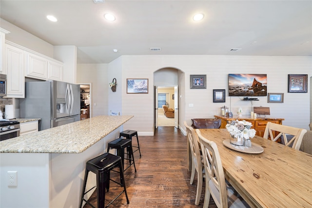 dining room featuring dark wood-type flooring