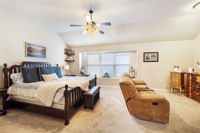 carpeted bedroom featuring vaulted ceiling and ceiling fan