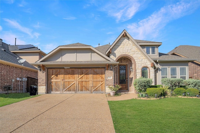 view of front facade with a garage and a front yard