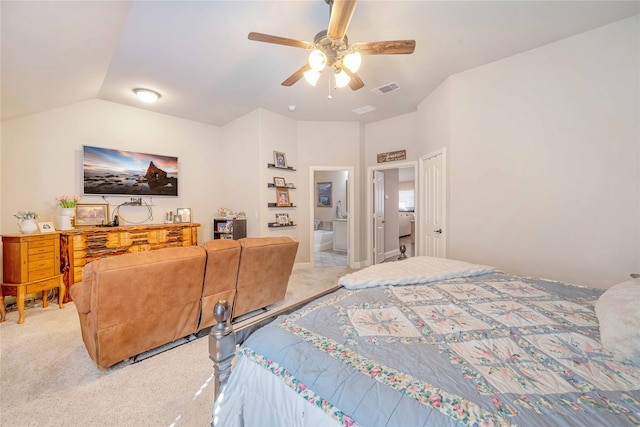 bedroom featuring light colored carpet, ceiling fan, lofted ceiling, and ensuite bathroom