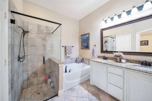 bathroom featuring tile patterned floors, vanity, and plus walk in shower