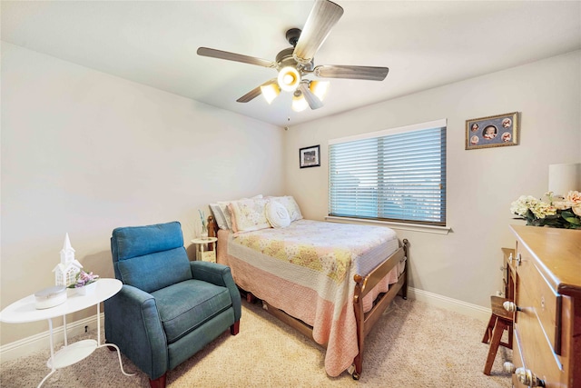 bedroom featuring ceiling fan and light colored carpet