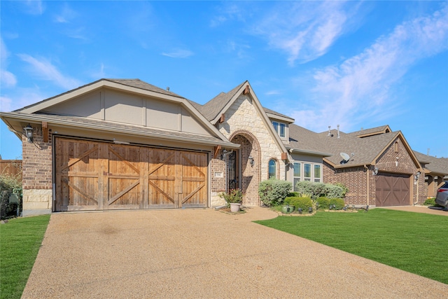 view of front of house featuring a front yard and a garage