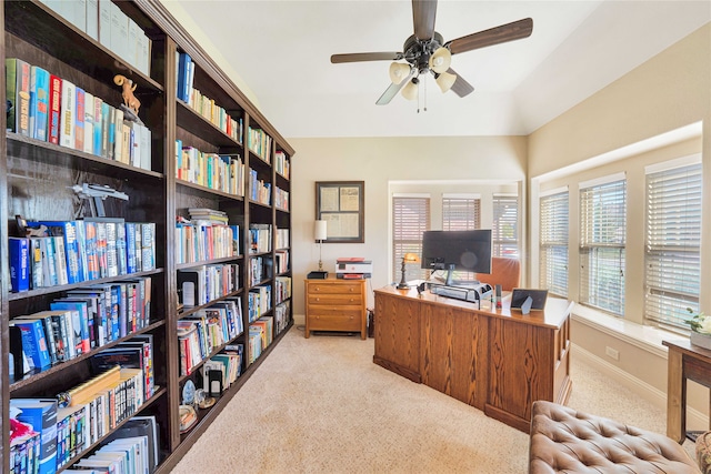 office area featuring light carpet and ceiling fan