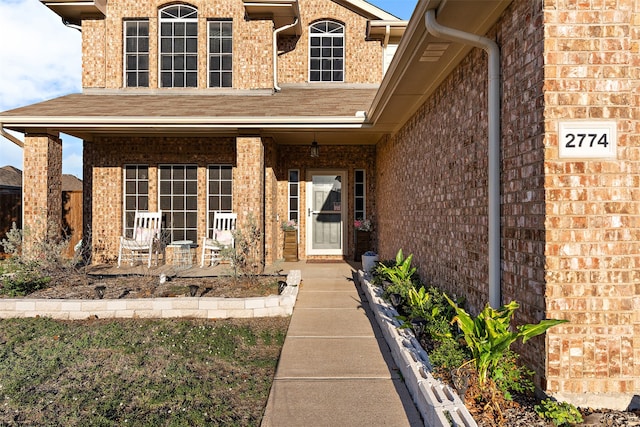 property entrance with covered porch