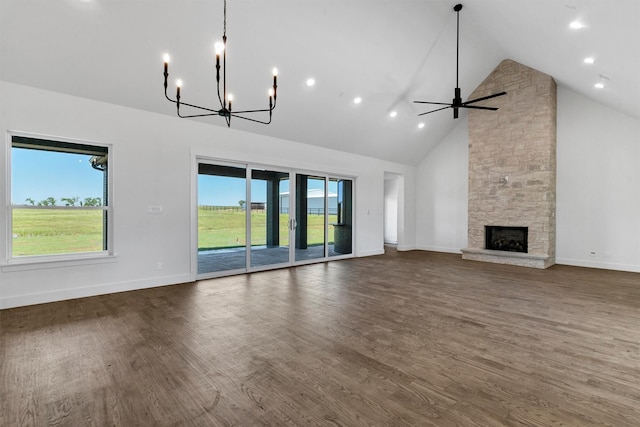 5360 Moncrief Rd, Justin, TX 76247 - unfurnished living room featuring high vaulted ceiling, dark wood finished floors, and baseboards