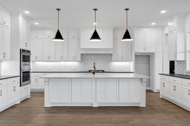 5360 Moncrief Rd, Justin, TX 76247 - kitchen featuring double oven, white cabinetry, backsplash, and dark wood-style floors