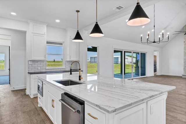 5360 Moncrief Rd, Justin, TX 76247 - kitchen with visible vents, open floor plan, plenty of natural light, a sink, and appliances with stainless steel finishes