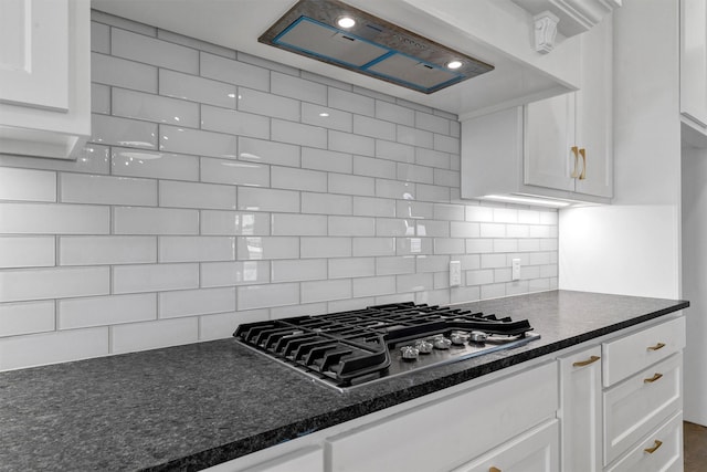 5360 Moncrief Rd, Justin, TX 76247 - kitchen featuring stainless steel gas cooktop, backsplash, white cabinets, and custom range hood