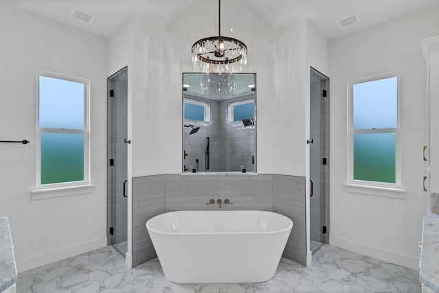 5360 Moncrief Rd, Justin, TX 76247 - bathroom featuring baseboards, visible vents, a soaking tub, and marble finish floor