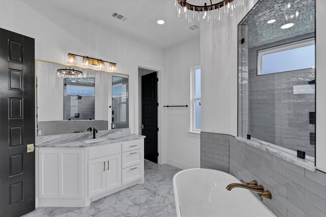 5360 Moncrief Rd, Justin, TX 76247 - bathroom featuring a chandelier, visible vents, vanity, marble finish floor, and a soaking tub