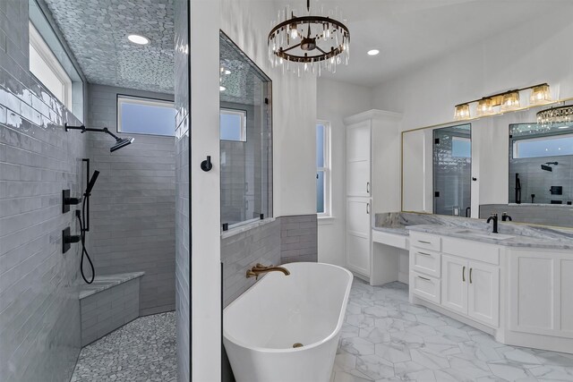 5360 Moncrief Rd, Justin, TX 76247 - full bath with a freestanding tub, walk in shower, vanity, marble finish floor, and an inviting chandelier