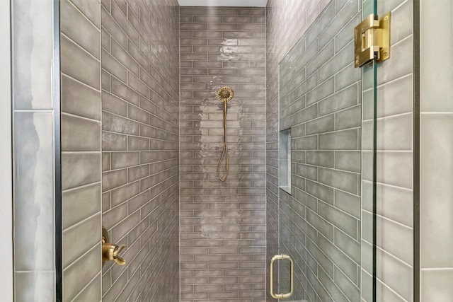 bathroom with a shower with shower door