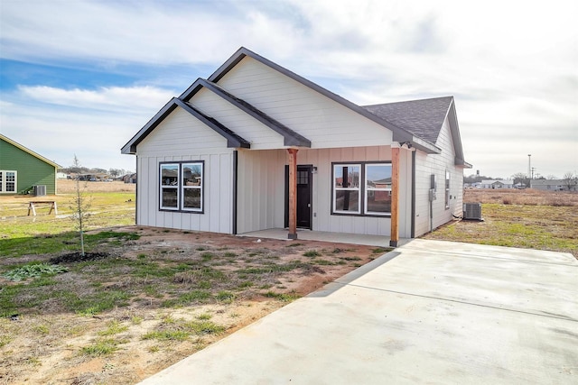 view of front of home with central AC unit and a patio area