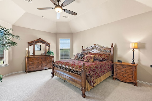 carpeted bedroom with vaulted ceiling and ceiling fan