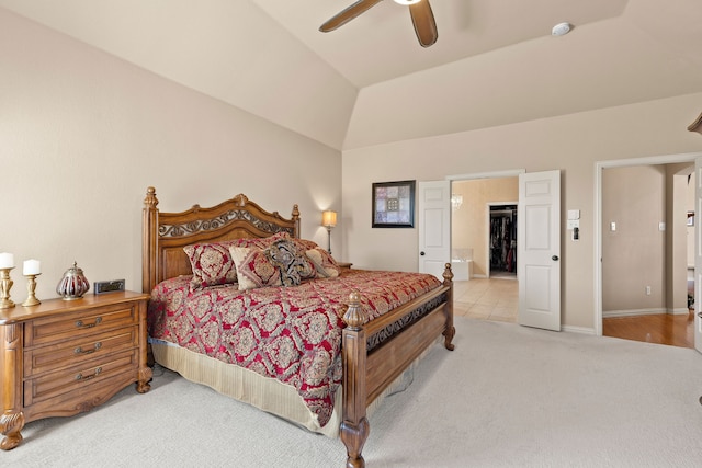 carpeted bedroom with ceiling fan and lofted ceiling