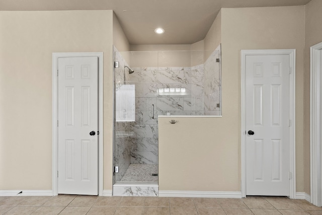 bathroom with tile patterned flooring and an enclosed shower