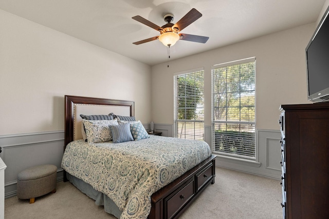 bedroom featuring ceiling fan and light colored carpet