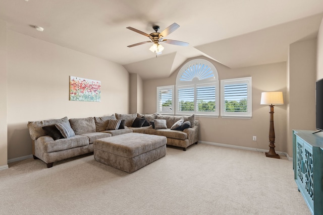 carpeted living room with vaulted ceiling and ceiling fan