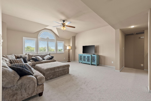 carpeted living room featuring ceiling fan and lofted ceiling