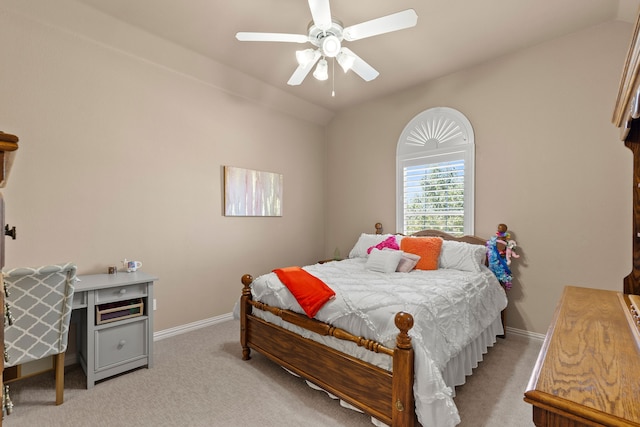 carpeted bedroom with ceiling fan and lofted ceiling