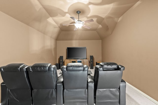 carpeted cinema with ceiling fan and lofted ceiling