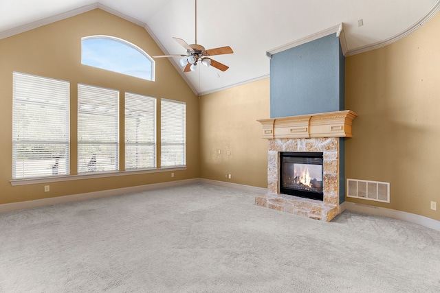 unfurnished living room with ornamental molding, a fireplace, carpet floors, and ceiling fan