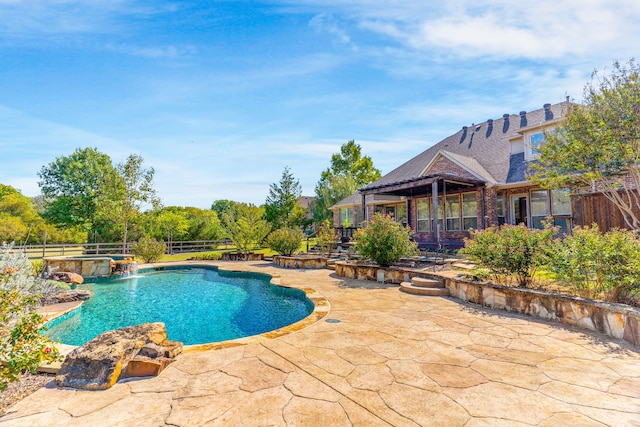 view of swimming pool featuring a patio area and pool water feature