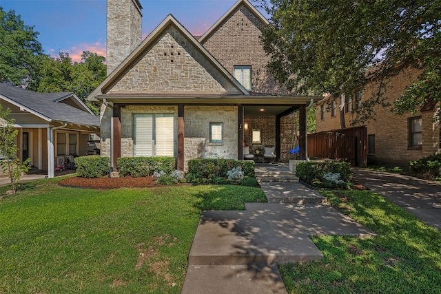 view of front of home with a lawn