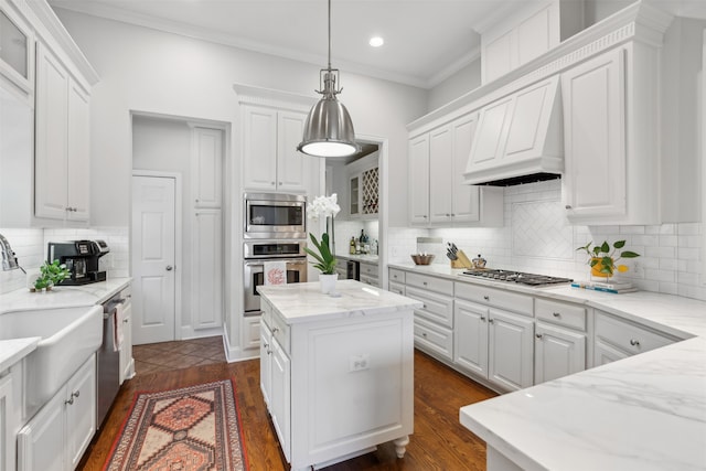 kitchen featuring white cabinets, appliances with stainless steel finishes, and a kitchen island