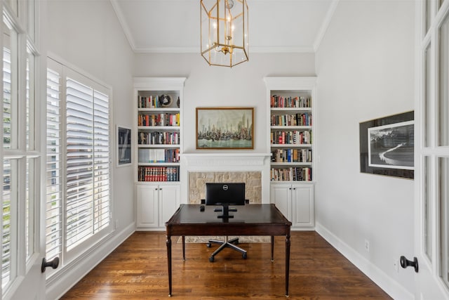 office featuring a notable chandelier, built in shelves, dark hardwood / wood-style floors, and ornamental molding