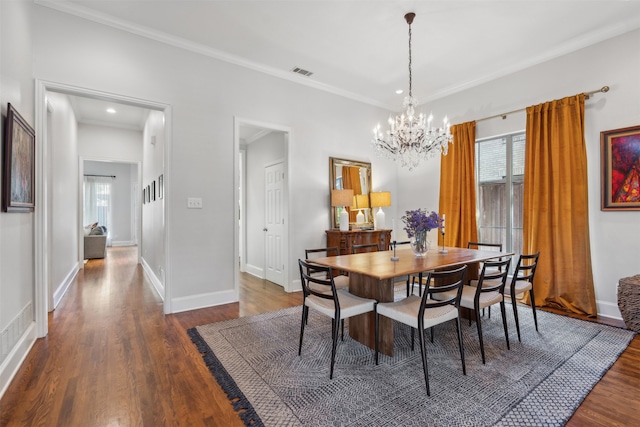 dining area with dark hardwood / wood-style floors and crown molding