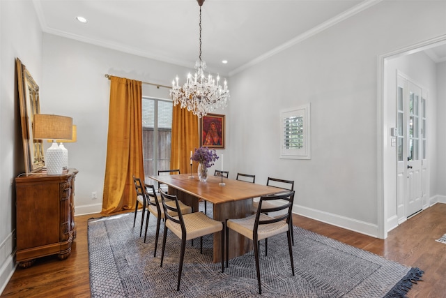 dining space with ornamental molding, dark hardwood / wood-style flooring, and a notable chandelier