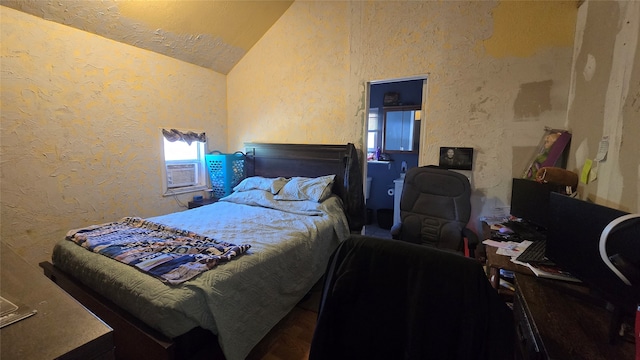 bedroom with lofted ceiling