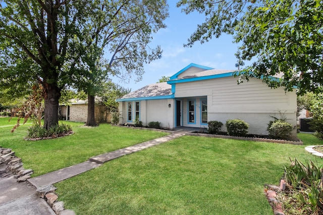 ranch-style house with a front yard