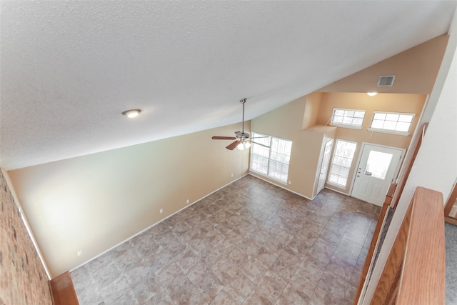 unfurnished living room featuring ceiling fan and high vaulted ceiling